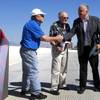 Clark County Commission Chairman Steve Sisolak, right, greets Jay Smith, left, president of Las Vegas Paving, and Bob Mendenhall, Las Vegas Paving owner, during an opening ceremony for the new flyover ramp linking the Airport Connector to eastbound 215 Monday, June 5, 2017. The ramp is more than 1/2 mile long and is expected to carry more than 20,000 vehicles per day.