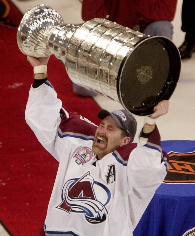 Colorado Avalanche defensemen Ray Bourque celebrates with the the Stanley Cup in Denver on Saturday, June 9, 2001. The Avalanche beat the Devils 3-1 in game seven to capture the cup.