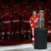 Detroit Red Wings captain Nicklas Lidstrom, of Sweden, holds the Stanley Cup trophy during the teams championship banner-raising prior to their NHL hockey season-opener against the Toronto Maple Leafs in Detroit, Thursday, Oct. 9, 2008. 