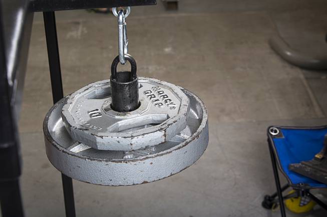 A counterweight provides resistance on a custom-made arm wresting training machine in Jeff Alexander's garage gym Sunday, June 11, 2017. Alexander is training for the World Armwrestling League Amateur Championships being held June 30 at the House of Blues in Mandalay Bay.