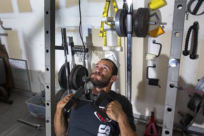 Arm wrestler Jeff Alexander works out in his garage gym Sunday, June 11, 2017. Alexander is training for the World Armwrestling League Amateur Championships being held June 30 at the House of Blues in Mandalay Bay.