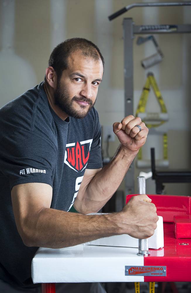 Arm wrestler Jeff Alexander poses in his garage gym Sunday, June 11, 2017. Alexander is training for the World Armwrestling League Amateur Championships being held June 30 at the House of Blues in Mandalay Bay.