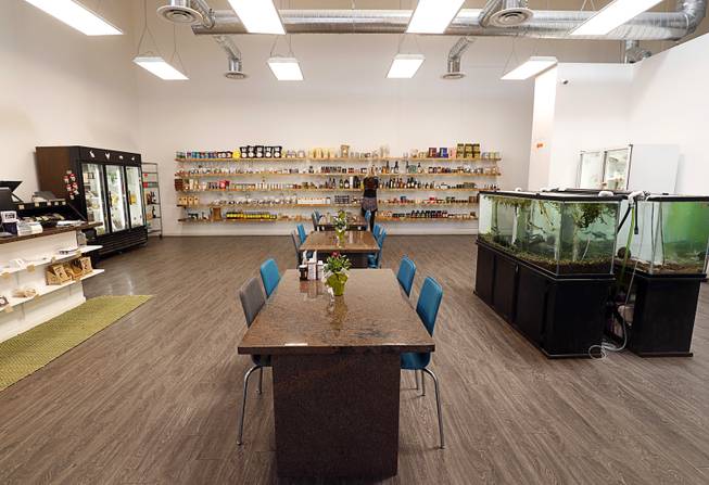 An interior view of Artisanal Foods, 2053 E. Pama Lane, Monday, June 12, 2017. The shop has a curated collection of products and tanks with sturgeon and lion fish so the staff can teach about sustainability.