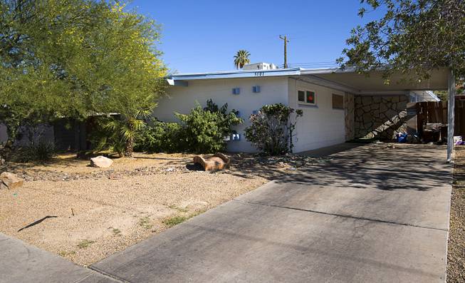 A home previously occupied by squatters is shown near Nellis Boulevard and Harmon Avenue Thursday, June 15, 2017. The home is vacant and was previously occupied by squatters.