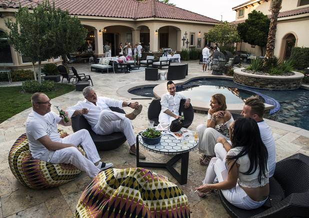 Guests gather poolside as A Magazine co-founders Dani Bald-Bruni and Lacey Murray host an anniversary party celebrating their first year of publishing the magazine which mixes real estate, design and lifestyle content on Saturday, June 10, 2017.