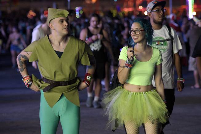 A couple strolls the festival grounds in costume during the first night of the Electric Daisy Carnival Saturday, June 17, 2017, at the Las Vegas Motor Speedway. Total attendance at the three night festival, the largest electronic dance music festival in North America, is expected to surpass 400,000.