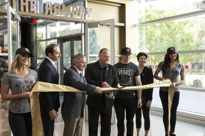 Las Vegas Golden Knights coach Gerard Gallant cuts the ceramonial ribbon during the openeing of  "The Armory", the teams official store at the T-Mobile Arena, Monday June 19, 2017.