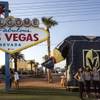 The Golden Knights display a giant inflatable as they show off their new uniforms to the fans gathered at the Welcome To Las Vegas sign on Tuesday, June 16, 2017.