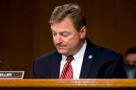 Sen. Dean Heller arrives as Federal Reserve Chair Janet Yellen testifies in front of the Senate Banking Committee in Washington, Tuesday, Feb. 14, 2017. 