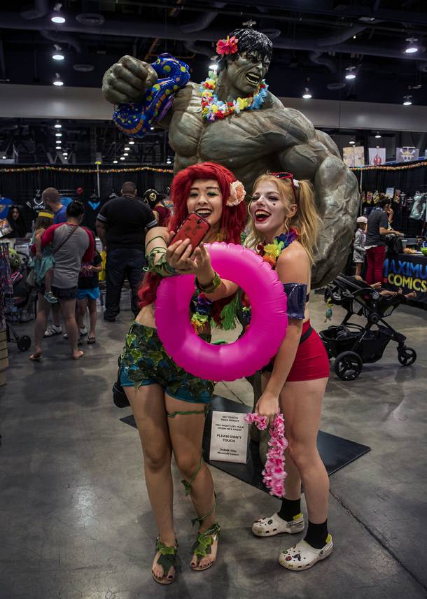 Adriana Solares as Poison Ivy and Amanda Lee as Harley Quinn take a pic with the Incredible Hulk during the Amazing Las Vegas Comic Con at the Las Vegas Convention Center on Friday, June 23, 2017.