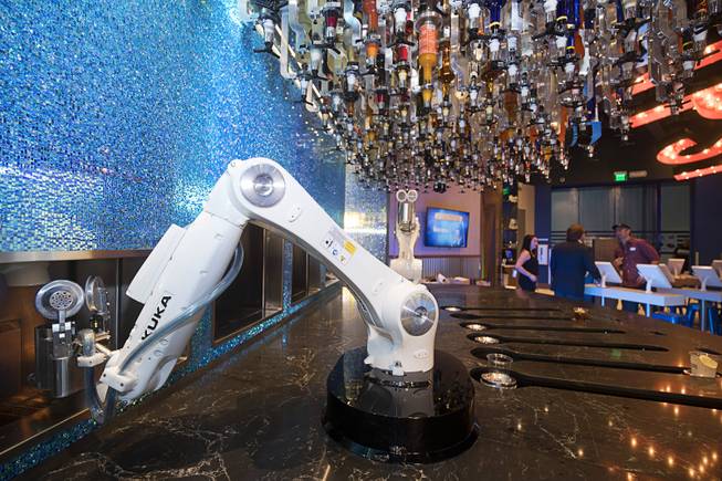 Robotic bartenders prepare drinks in the Tipsy Robot automated bar in the Miracle Mile Shops at Planet Hollywood Monday, June 26, 2017. The bar is scheduled to open on Friday.