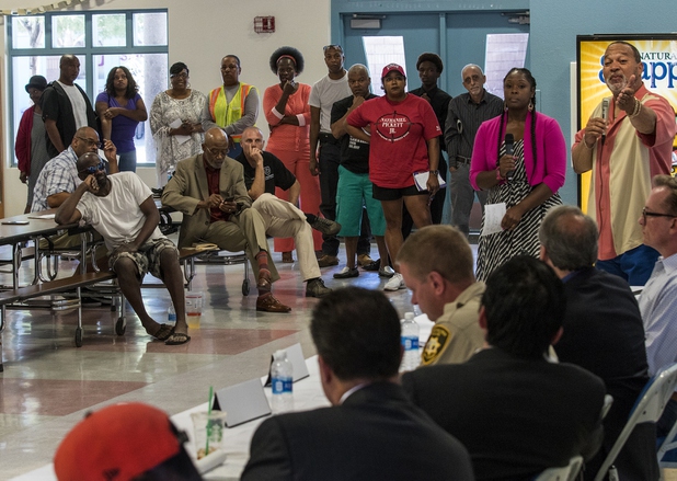 Attendees line up for more questions of the board as the local chapter of the NAACP sponsors an info session and discussion on Nevada's legal process when someone is killed held at West Prep Academy on Friday, June 23, 2017.