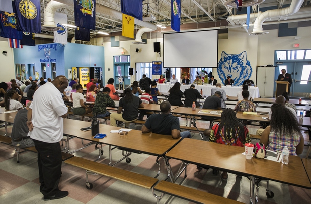 A prayer is given as the local chapter of the NAACP sponsors an info session and discussion on Nevada's legal process when someone is killed held at West Prep Academy on Friday, June 23, 2017.