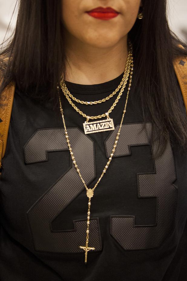 DeMarlo Berry's wife Odilia Berry wears a custom made necklace that says "Amazin" attributed to her faith in God during a press conference at the Eglet Prince law firm in downtown Las Vegas following DeMarlo's exoneration and release from prison after having served 22 years, Friday, June 30, 2017.