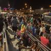 Customers wait in a long line at Reef Dispensaries in Las Vegas as recreational marijuana sales begin at midnight in Nevada on Friday, June 30, 2017.