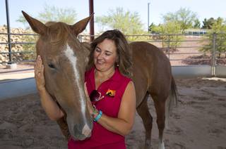 Linda Florence of L.E.A.N. strokes a horse named Roxy (Roxanne) at the Lone Mountain Equestrian Park Sunday July 2, 2017. L.E.A.N. (Local Equine Assistance Network) is a Las Vegas nonprofit that helps horses that have been abandoned or neglected.