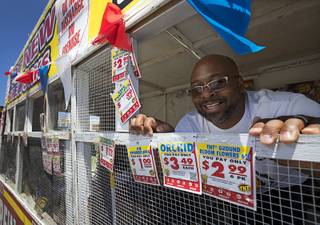 Bonanza High School football coach Dion Lee looks out from a fundraising fireworks booth at the Terrible Herbst at Buffalo Drive and Lake Mead Boulevard Monday July 3, 2017. The firework sales are part of Lee's efforts to raise $100,000 for the football program, he said.