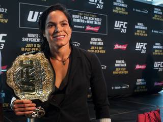 UFC213 women's bantamweight champion Amanda Nunes holds her belt as fighters meet with the media at the T-Mobile Arena on Thursday, July 6, 2017.
