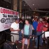Gerald Winchester, left, chats with Marie Marine, right, as they wait to enter the former Trump Taj Mahal casino in Atlantic City N.J. on Thursday July 6, 2017, for a sale of the casino hotel's contents. Included in the items for sale were crystal chandeliers from Austria that now-President Donald Trump bought for the casino when he opened it in 1990. The casino shut down last year under different ownership.