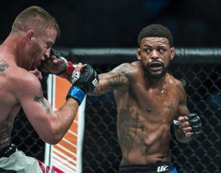 Lightweight Justin Gaethje receives a punch to the face from Michael Johnson in The Ultimate Fighter: Redemption Finale at the T-Mobile Arena on Friday, July 7, 2017.