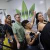 People wait in line at the Essence cannabis dispensary in Las Vegas, Saturday, July 1, 2017, as recreational sales of marijuana begin. 