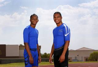 Brothers Justin Johnson, left, 14, Jayson Johnson, 18, pose at the Durango High School track Tuesday, July 11, 2017. The brothers have qualified for the Junior Olympics.