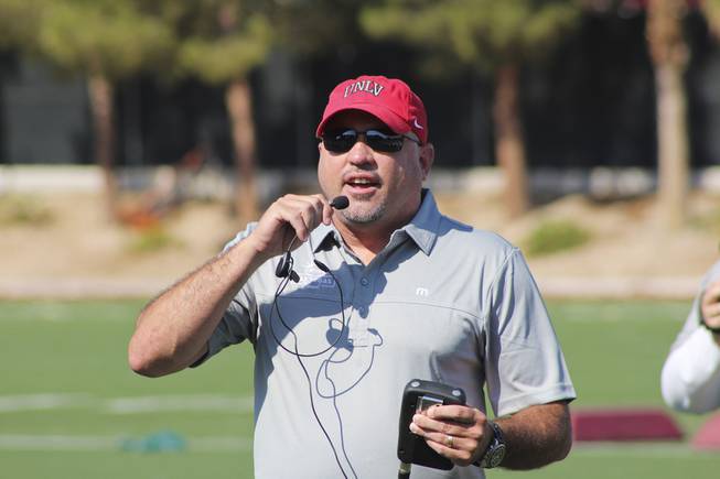 UNLV football coach Tony Sanchez makes calls during the Las ...