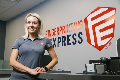 Monica Pappas, co-founder of FingerPrinting Express, poses for a photo on location, Wednesday, July 12, 2017. Photo by Wade Vandervort