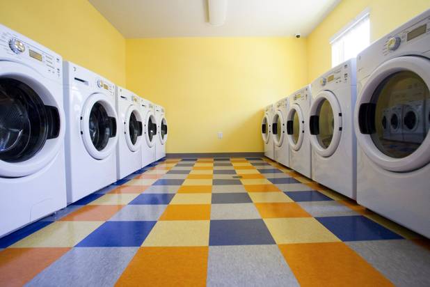The laundry facilities are seen during the grand opening ceremony of the new Shannon West Homeless Youth Center, Friday, July 14, 2017.