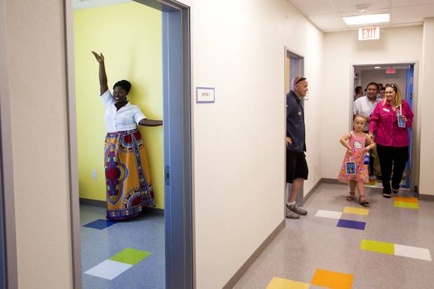 Manager of Shannon West Homeless Youth Center MeShayla Ennis poses for a photo inside her new office as people tour the new Shannon West Youth Center during the grand opening ceremony at its new location, Friday, July 14, 2017.
