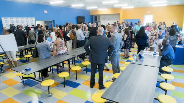The media and guests gather in the cafeteria during the grand opening ceremony of the new Shannon West Homeless Youth Center, Friday, July 14, 2017.