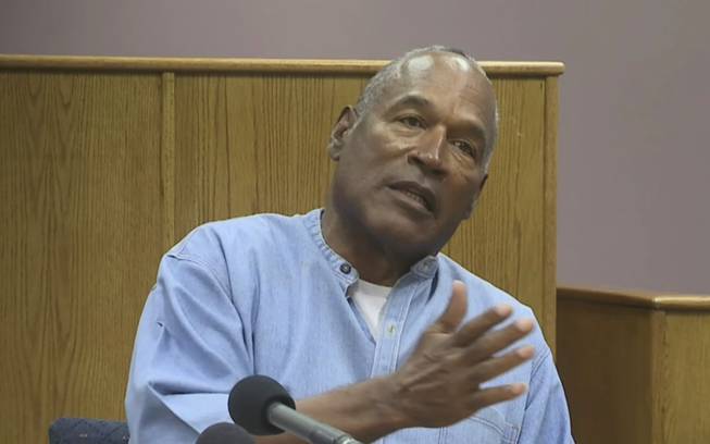Former NFL football star O.J. Simpson appears via video for his parole hearing at the Lovelock Correctional Center in Lovelock, Nev., on Thursday, July 20, 2017. Simpson was convicted in 2008 of enlisting some men he barely knew, including two who had guns, to retrieve from two sports collectibles sellers some items that Simpson said were stolen from him a decade earlier.