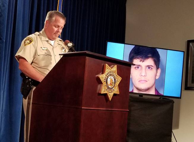 Metro Police Assistant Sheriff Todd Fasulo discusses the case involving Giuseppe Russo, shown on the screen, who was shot by police during a chase.