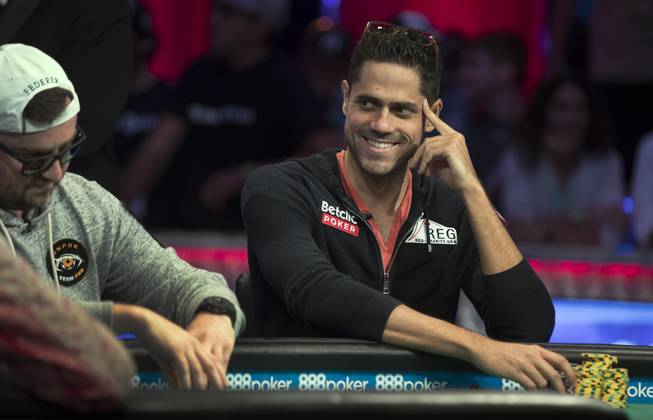 Benjamin Pollok laughs at another player during second of three straight nights to finish poker's world championship at the Rio on Friday, July 21 2017.