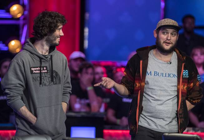 Daniel Ott and Bryan Piccioli joke around while going all in during the second of three straight nights to finish poker's world championship as the table goes from 7 to 3 players at the Rio on Friday, July 21 2017.