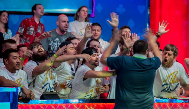 Scott Blumstein is congratulated by his fans after advancing to the final four during the second of three straight nights to finish poker's world championship as the table goes from 7 to 3 players at the Rio on Friday, July 21 2017.