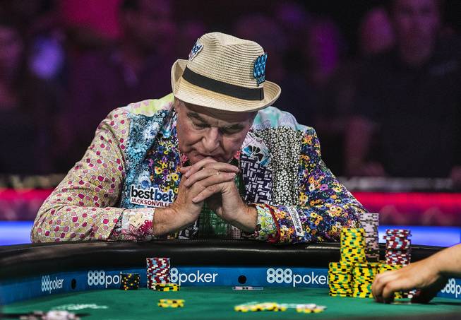 John Hesp contemplates going all in during the second of three straight nights to finish poker's world championship as the table goes from 7 to 3 players at the Rio on Friday, July 21 2017.