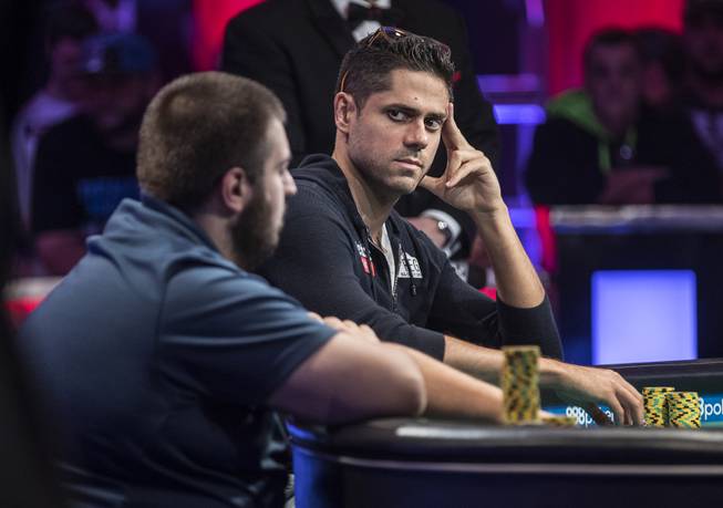 Benjamin Pollak eyes opponent Scott Blumstein who decides his next move during the last night of the WSOP to finish poker's world championship as the table goes from 3 to a winner at the Rio on Saturday, July 22 2017.