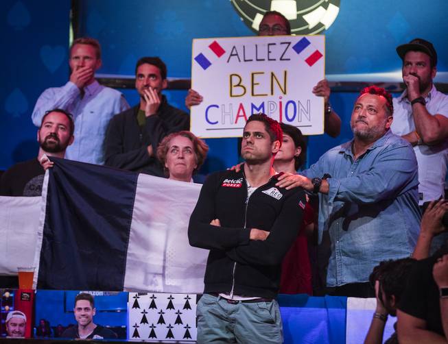 Benjamin Pollak is consoled by supporters after a losing hand and exiting third during the last night of the WSOP to finish poker's world championship as the table goes from 3 to a winner at the Rio on Saturday, July 22 2017.