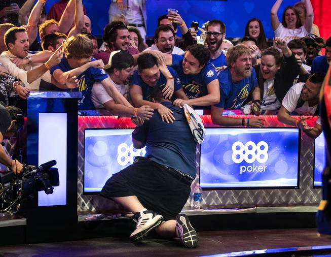 WSOP player Scott Blumstein collapses before his supporters after winning poker's world championship at the Rio on Sunday, July 23 2017.