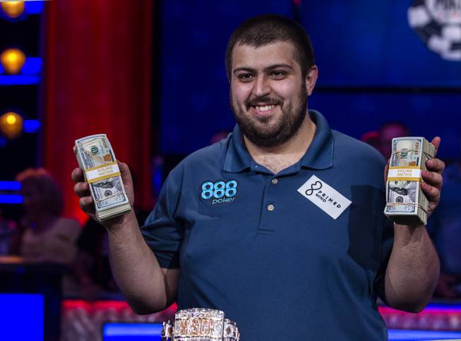 WSOP player Scott Blumstein shows off some cash after winning poker's world championship at the Rio on Sunday, July 23 2017.