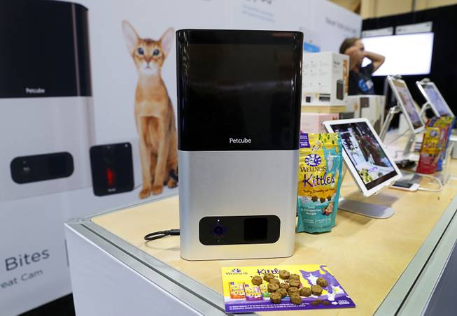 A Petcube Bites, an Internet-enabled treat dispenser, is displayed during the 2017 SuperZoo, a convention for pet retailers, at the Mandalay Bay Convention Center Tuesday, July 25, 2017. The device, with video camera and 2-way audio, also lets the pet corner control the speed at which the treat comes out of the dispenser.