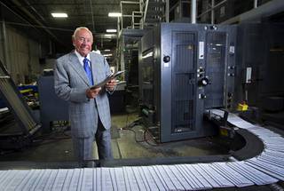Allan Creel Sr., chairman and CEO of Creel Printing poses by a printing press at the company, 6330 W Sunset Rd., Wednesday, Aug. 2, 2017.
