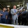 Allan Howard Creel, chairman of Creel Printing, poses with employees by a printing press at the company, 6330 W. Sunset Road, Wednesday, Aug. 2, 2017.