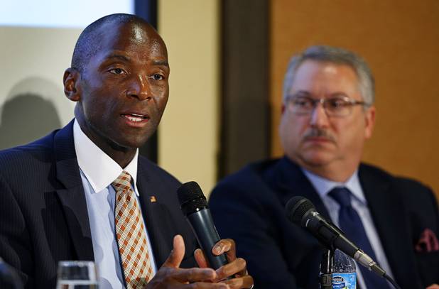 Terry Johnson, left, a member of the Nevada Gaming Control Board, speaks during a Responsible Gaming Panel at UNLV Thursday, Aug. 3, 2017. Alan Feldman, executive vice president of global government & industry affairs at MGM Resorts International, listens at right.