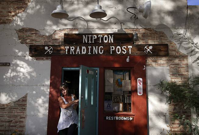 A woman leaves the Nipton Trading Post, Thursday, Aug. 3, ...