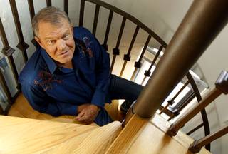 In this July 27, 2011 photo, musician Glen Campbell poses for a portrait in Malibu, Calif. Campbell, the grinning, high-pitched entertainer who had such hits as 