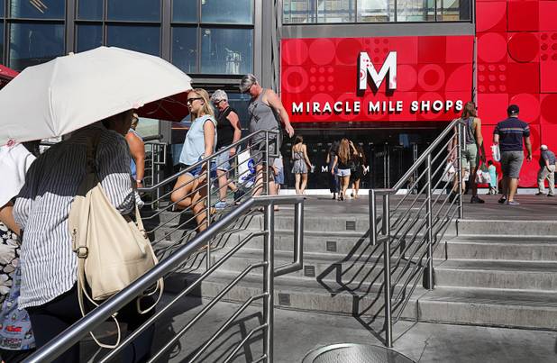 Pedestrians head toward the Miracle Mile Shops at Planet Hollywood on the Las Vegas Strip Tuesday, Aug. 8, 2017.