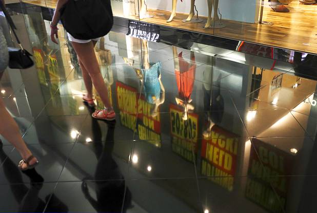 A store front is reflected on tile at the Miracle Miles Shops at Planet Hollywood on the Las Vegas Strip Tuesday, Aug. 8, 2017.