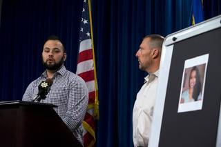 Paul Meadows, right, godfather to slaying victim Makayla Rhiner, listens as Freddy Lopez, Rhiner's friend, speaks during a news conference at Metro Police headquarters Wednesday, Aug. 9, 2017. Rhiner, 21, was found stabbed to death on Aug. 3, 2017. Her ex-boyfriend Brandon Hanson, 33, was arrested in the death.